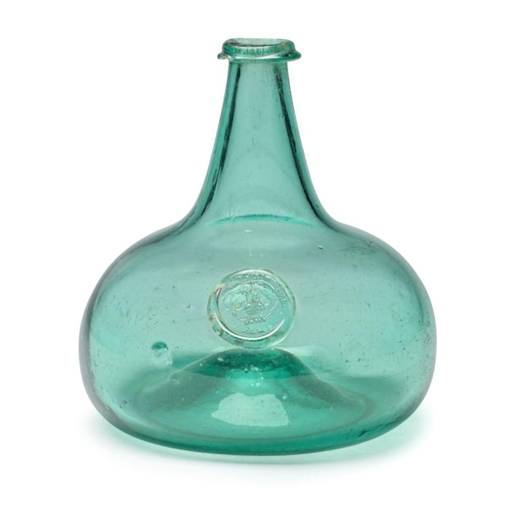 Green glass bottle with a bulbous body and narrow neck, photographed against a white background.