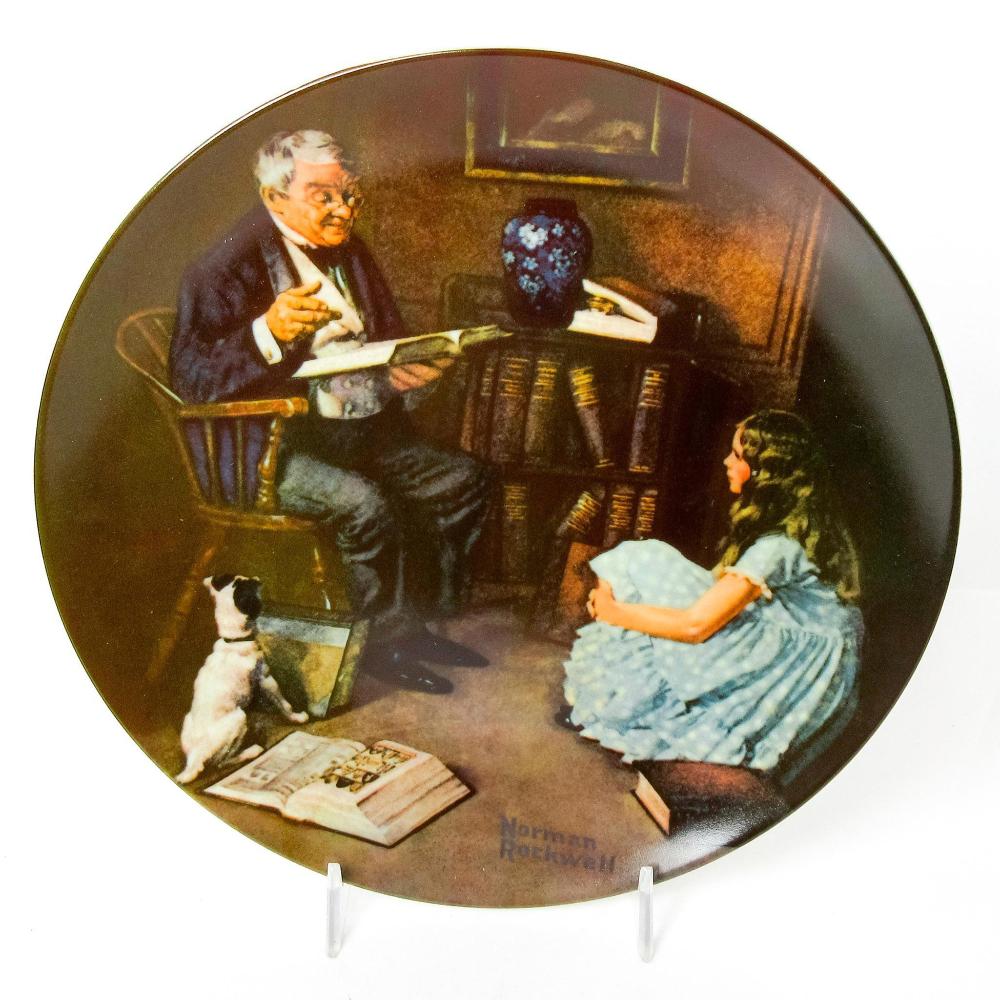 Decorative collectors plate featuring an illustration of an older man reading to a child in a living room with a dog.