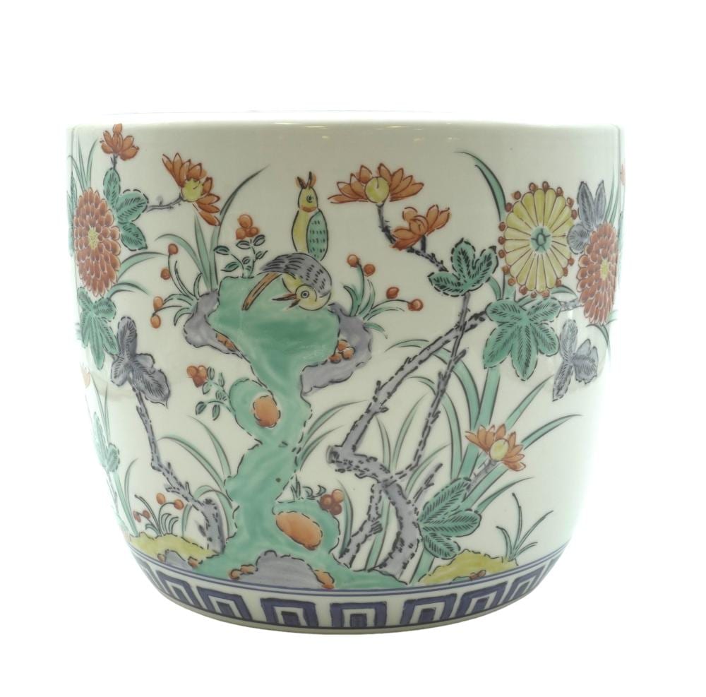 Chinese-style porcelain fishbowl planter with peony and crane-and-bird ornament in teal, orange, and gold tones.
