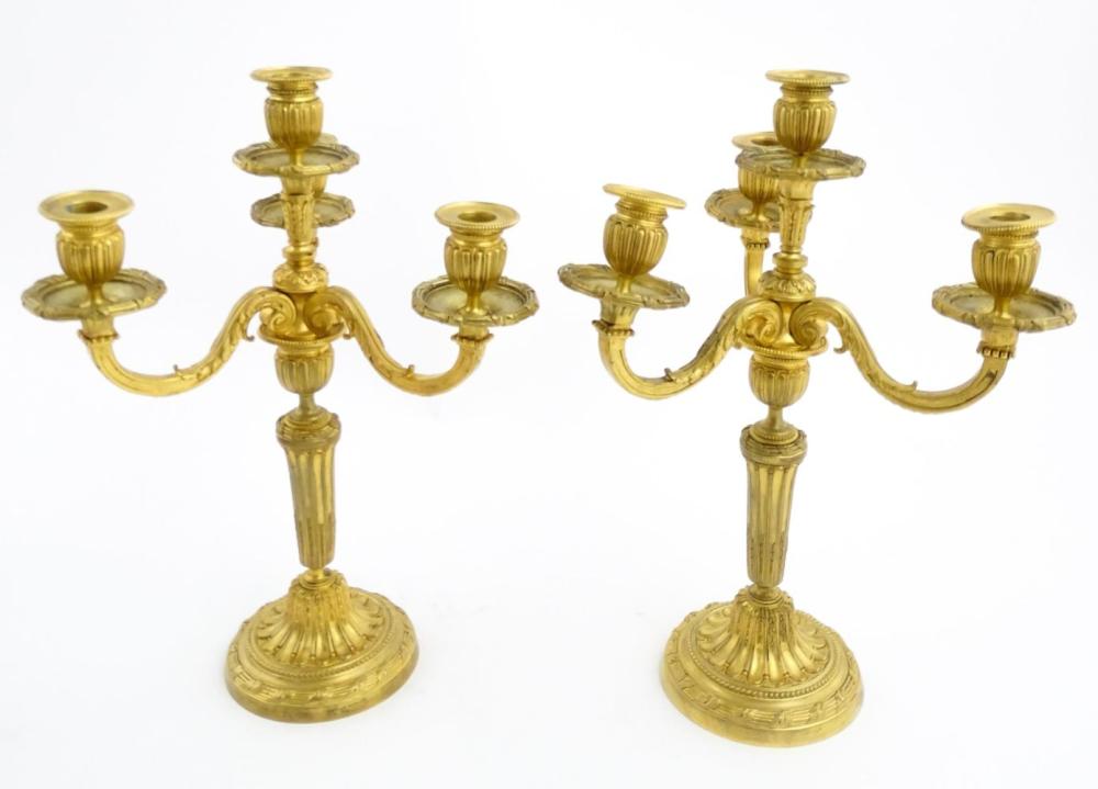 A pair of early 20thC French gilt bronze candelabr… sold by Claydon Auctioneers, lot 1019 — auction record photograph