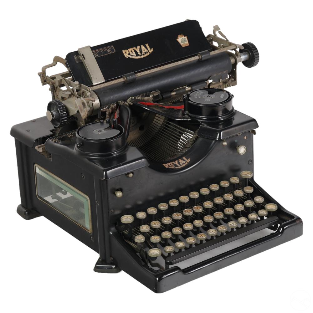 Black vintage Royal typewriter with visible keys and a paper tray, angled view on a white background.