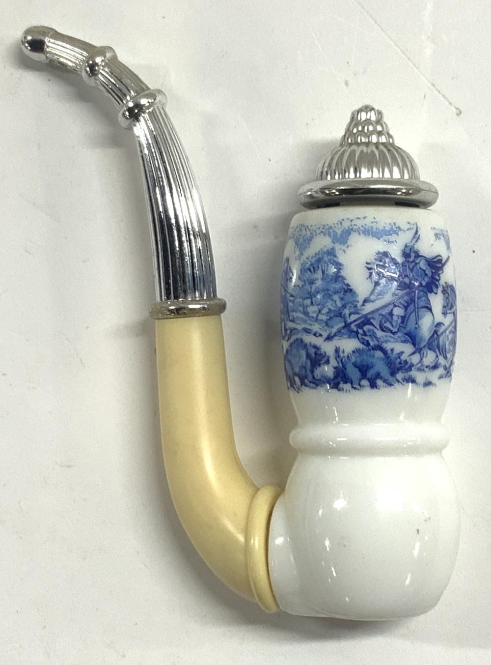 Vintage lotion bottle with a curved yellow tube and a white base, topped by a chrome cap with a blue-and-white printed sleeve.