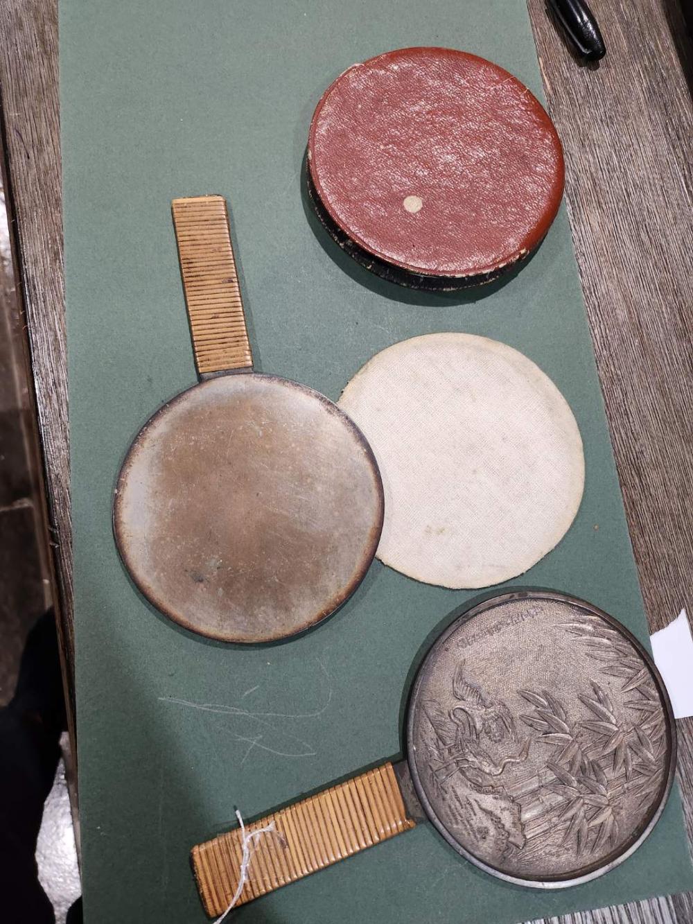 Japanese bronze circular hand mirrors. sold by David G Smith Auctions, lot 81 — auction record photograph