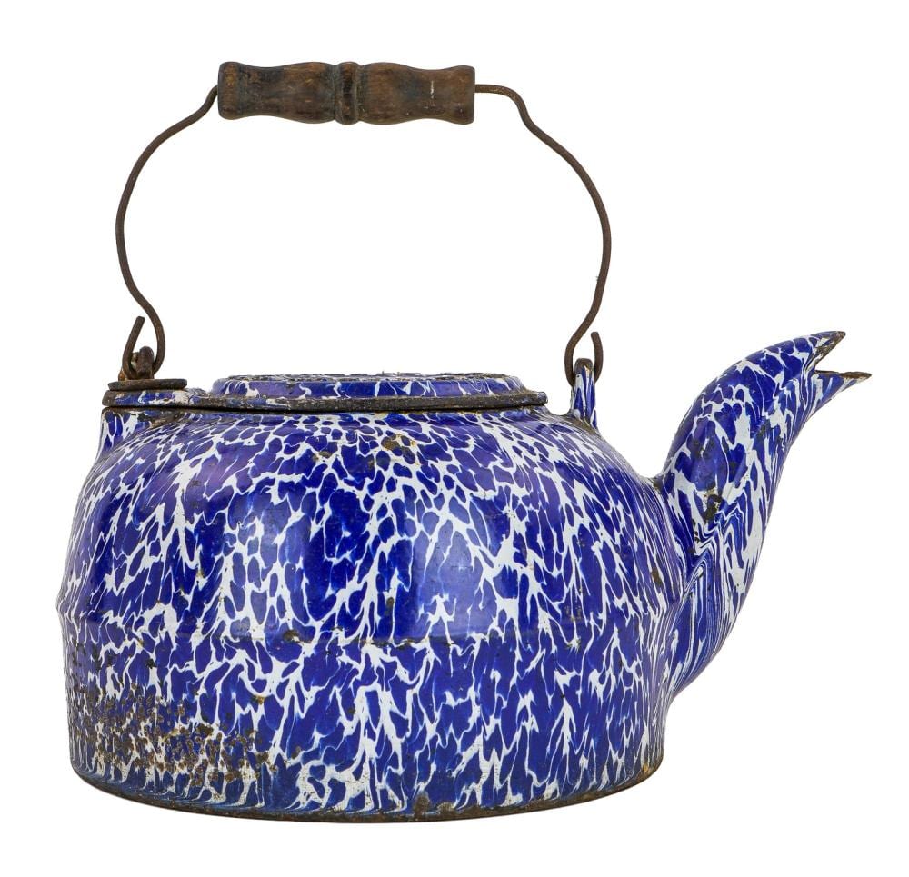 Blue and white speckled enamel tea kettle with curved spout, handle, and hanging loop handle on top.