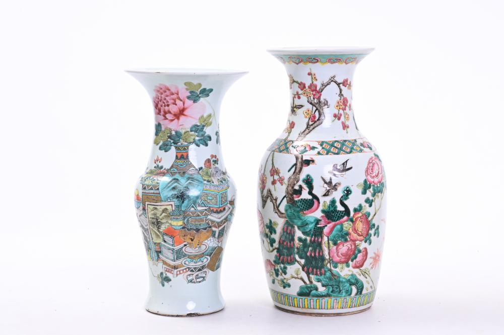 Pair of Chinese-style porcelain vases with multicolored floral and bird scenes, including branches and peony-like blossoms, photographed on a white background.