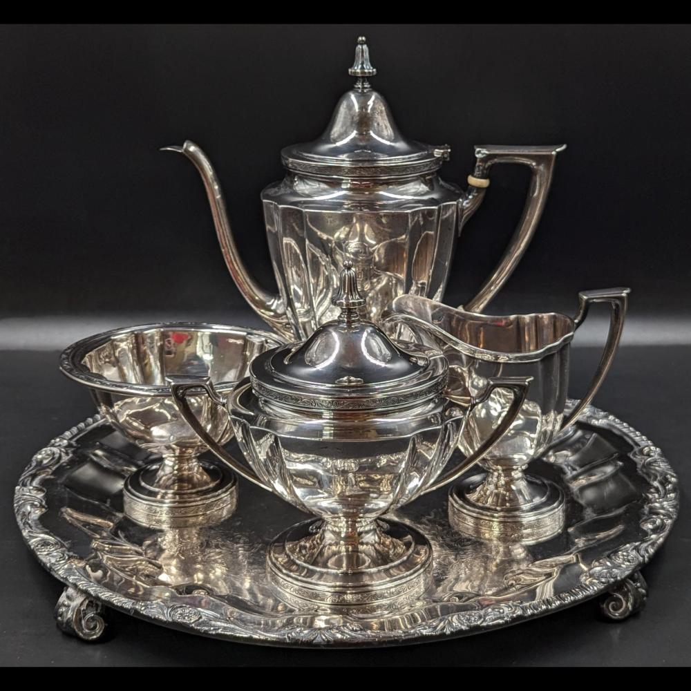 Auction comp thumbnail for A Fine Wallace Sterling Silver Tea Set With Silver-Plated Copper Tray, 1,282 Grams Total Weight (RB Fine Arts, Lot 27)