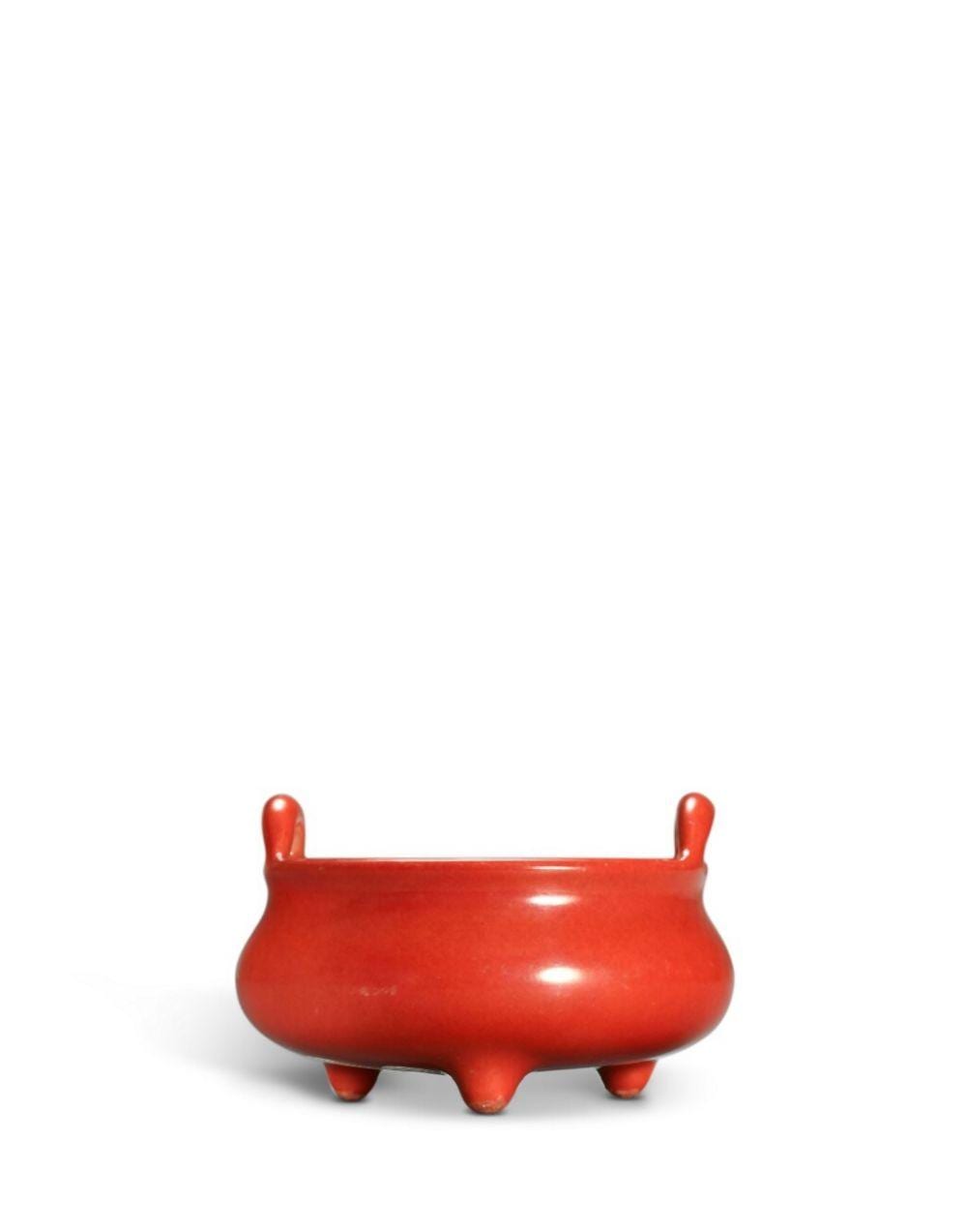A coral-red enamelled tripod incense burner, Mark and period of Yongzheng | 清雍正 珊瑚紅釉沖天耳三足爐 《雍正年製》款 comparable sale