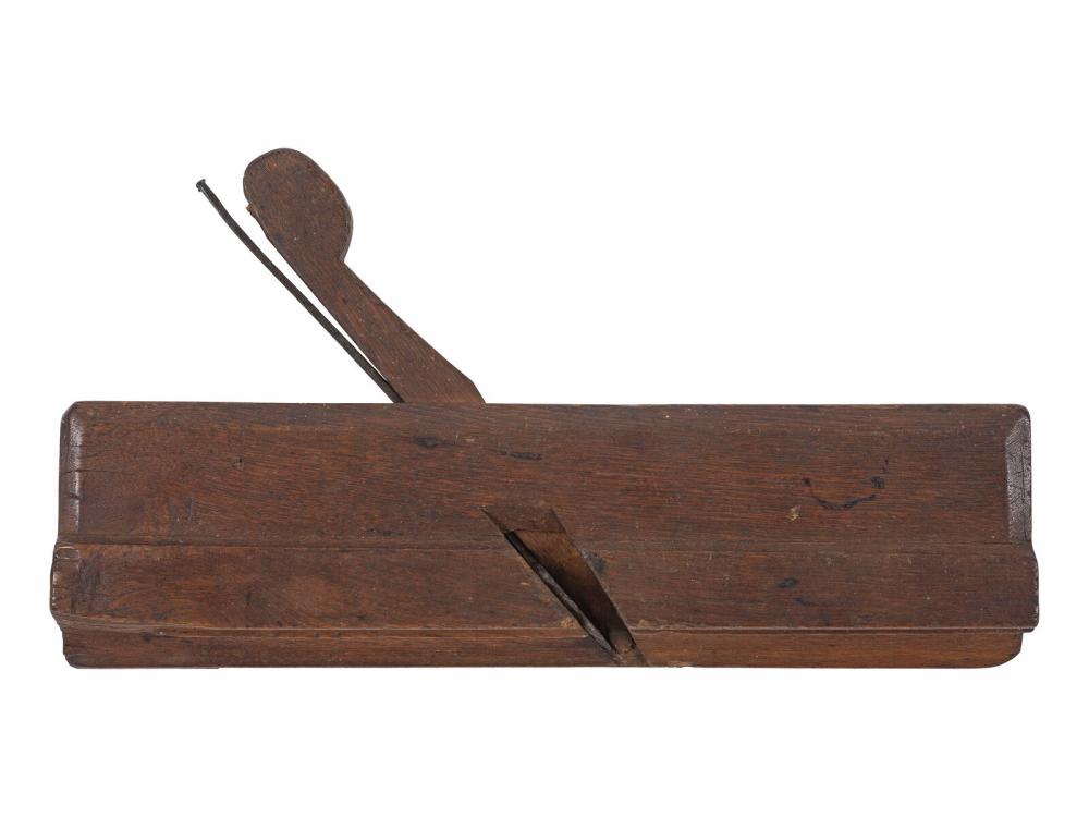 Wood hand molding plane tool with a long wooden body and metal blade at the front, shown against a white background.