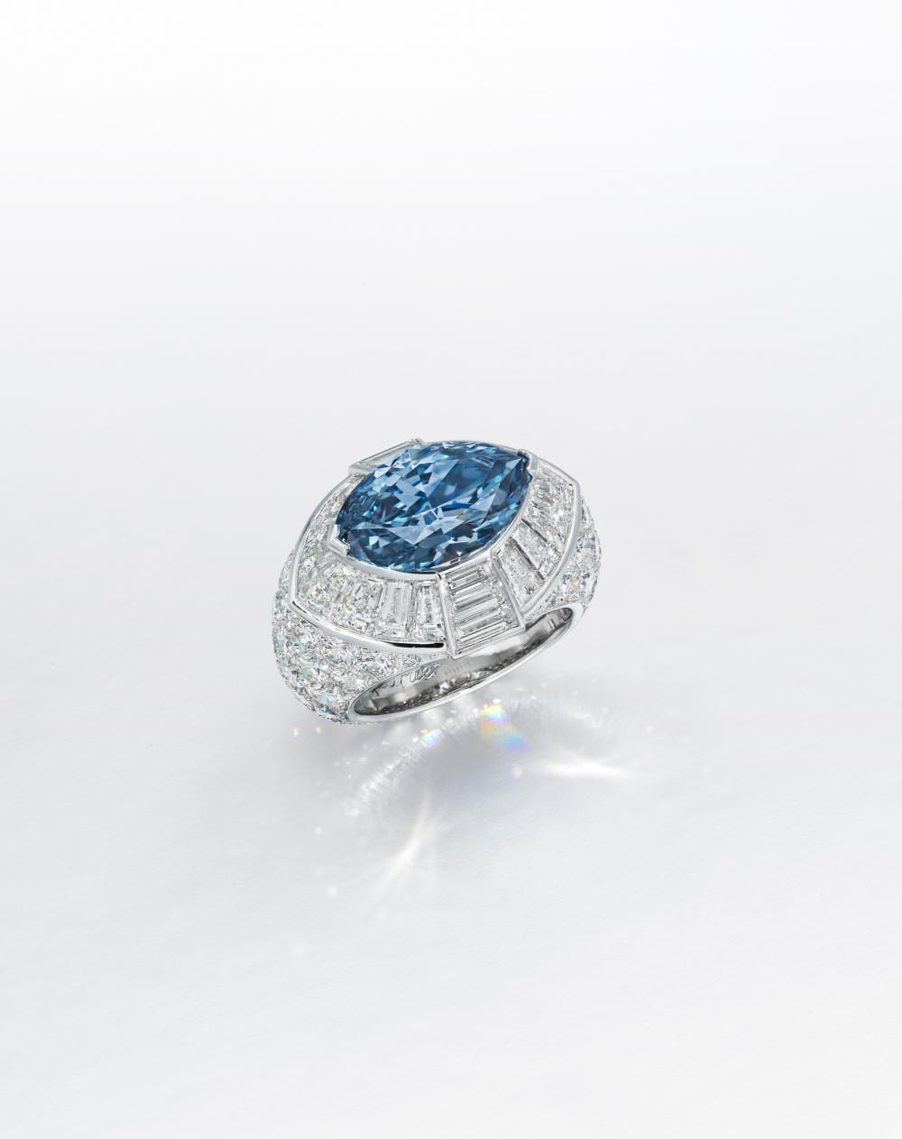 A SUPERB COLOURED DIAMOND AND DIAMOND RING, BY Cartier. comparable sale