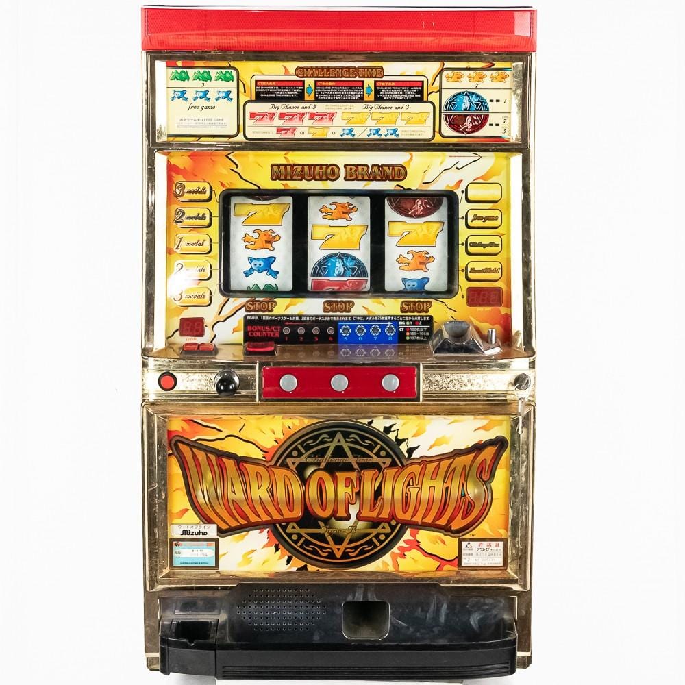 Front view of a gold-and-red Japanese-style token slot machine with three spinning reels and colorful game graphics labeled “MIZUHO BRAND” and “WINTER OF LIGHTS