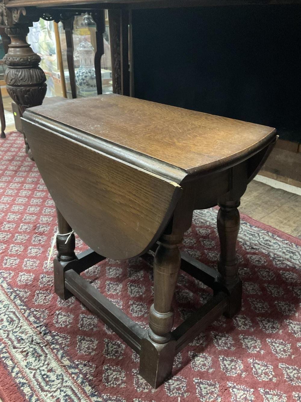 A. Sutherland comparable auction result: a miniature oak sutherland table