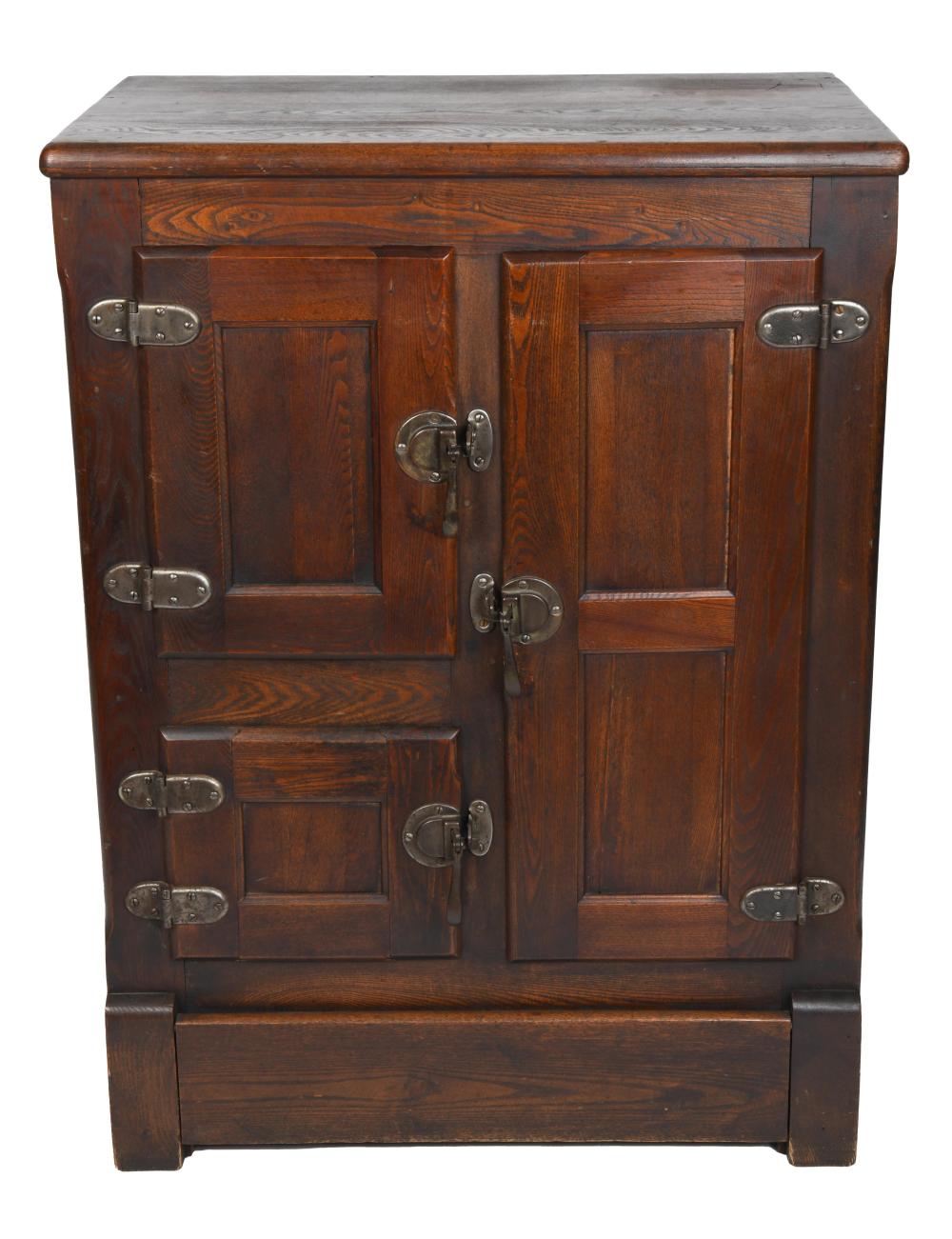 Front view of a wooden ice box with a hinged double door and metal latches, shown against a white background.