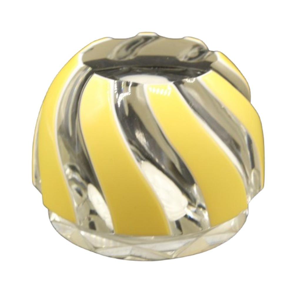 Yellow and clear glass paperweight with a faceted geometric pattern and curved top.