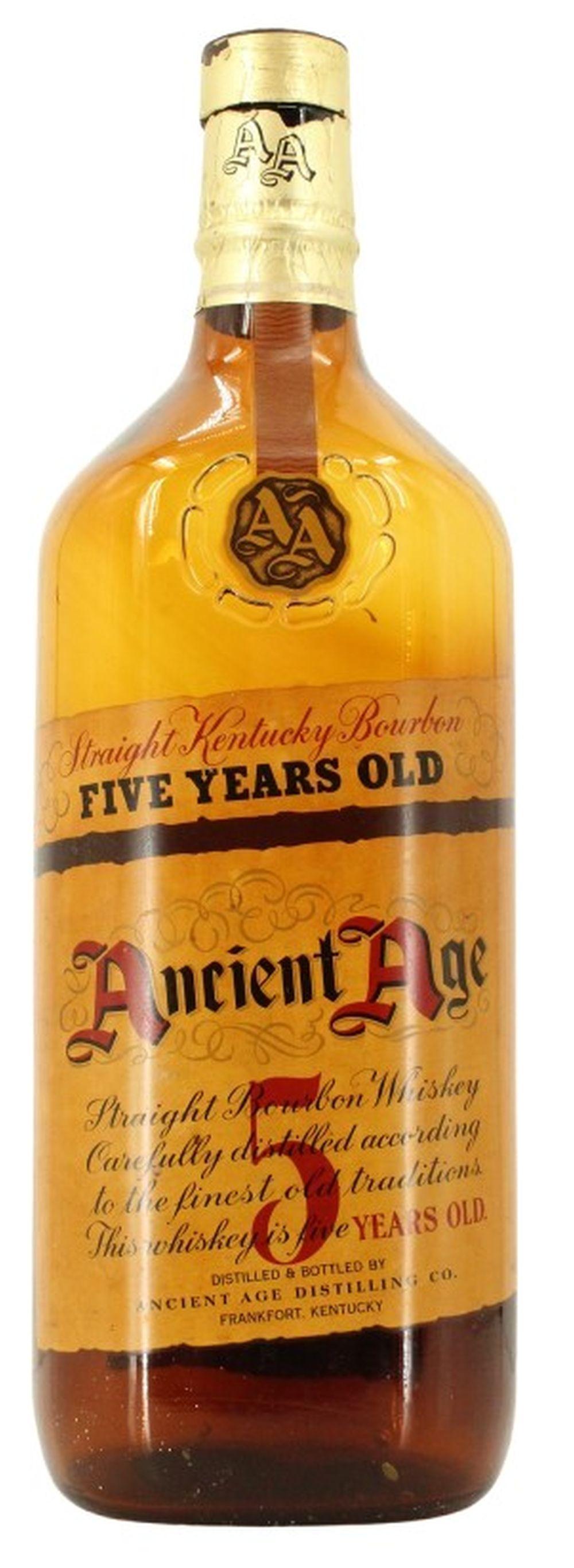 Whiskey bottle with gold foil neck label and printed text reading “FIVE YEARS OLD” and “Ancient Age” on a tan bottle.