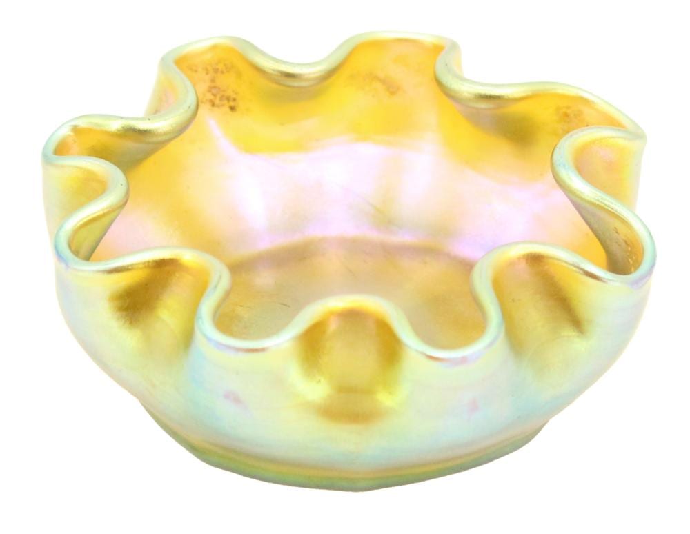 Iridescent yellow and opalescent glass master salt cellar with wavy rim and small scalloped handles.