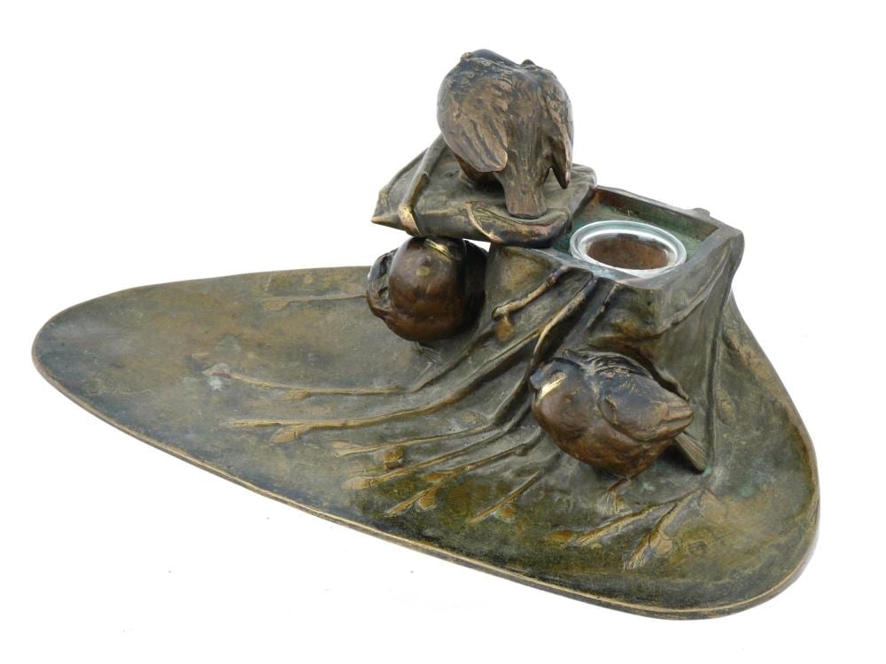 Art Nouveau style bronze inkwell shaped as a bird perched on a leaf with an open ink well cup.