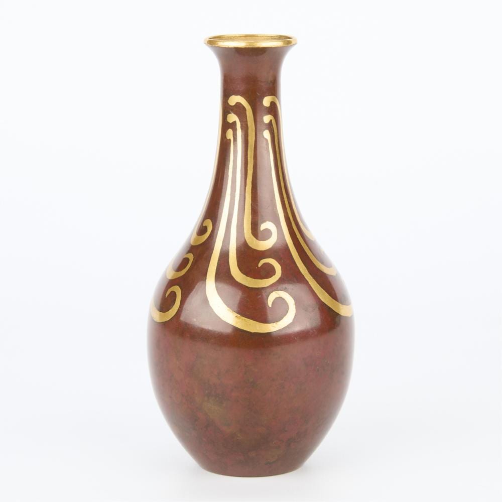 Red bottle-shaped vase with gold decorative swirl patterns and a gold rim at the top.