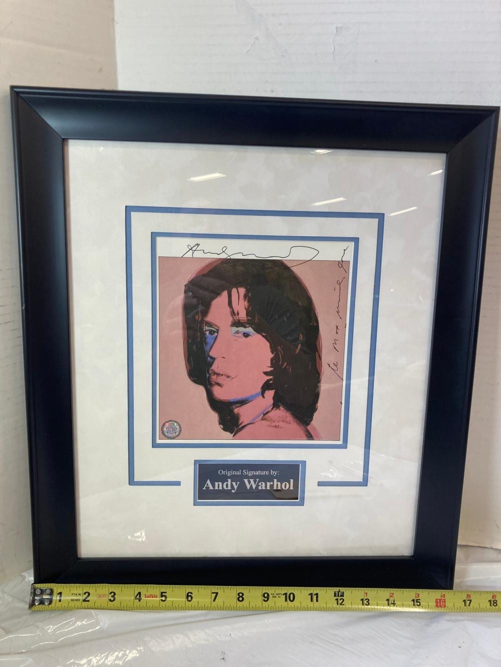 Andy Warhol's "Mick Jagger" Signed Lithograph Photo Frame sold by Joe R. Pyle Complete Auction & Realty LLC, lot 1354 — auction record photograph