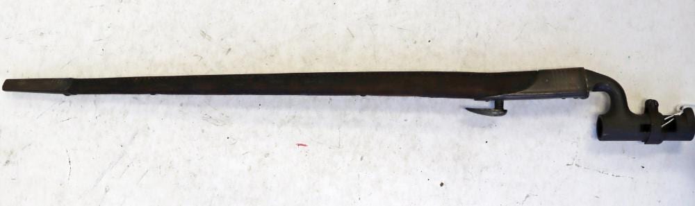 Metal bayonet-style blade with a black handle and crossguard, photographed against a light background.