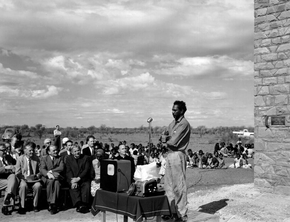 Enos Namatjira, Australian 1920-1966, Enos Namatjira speaking at the Unveiling of a Memorial to his Father Albert Namatjira at Hermannsburg, Black and White Vintage Photograph-stamped September 1962, 17cm by 22cm sold by For-Auction, lot 11 — auction record photograph