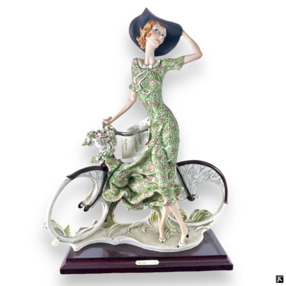 Giuseppe Armani Figurine "Lady On Bicycle" sold by Joshua Kodner, lot 158 — auction record photograph