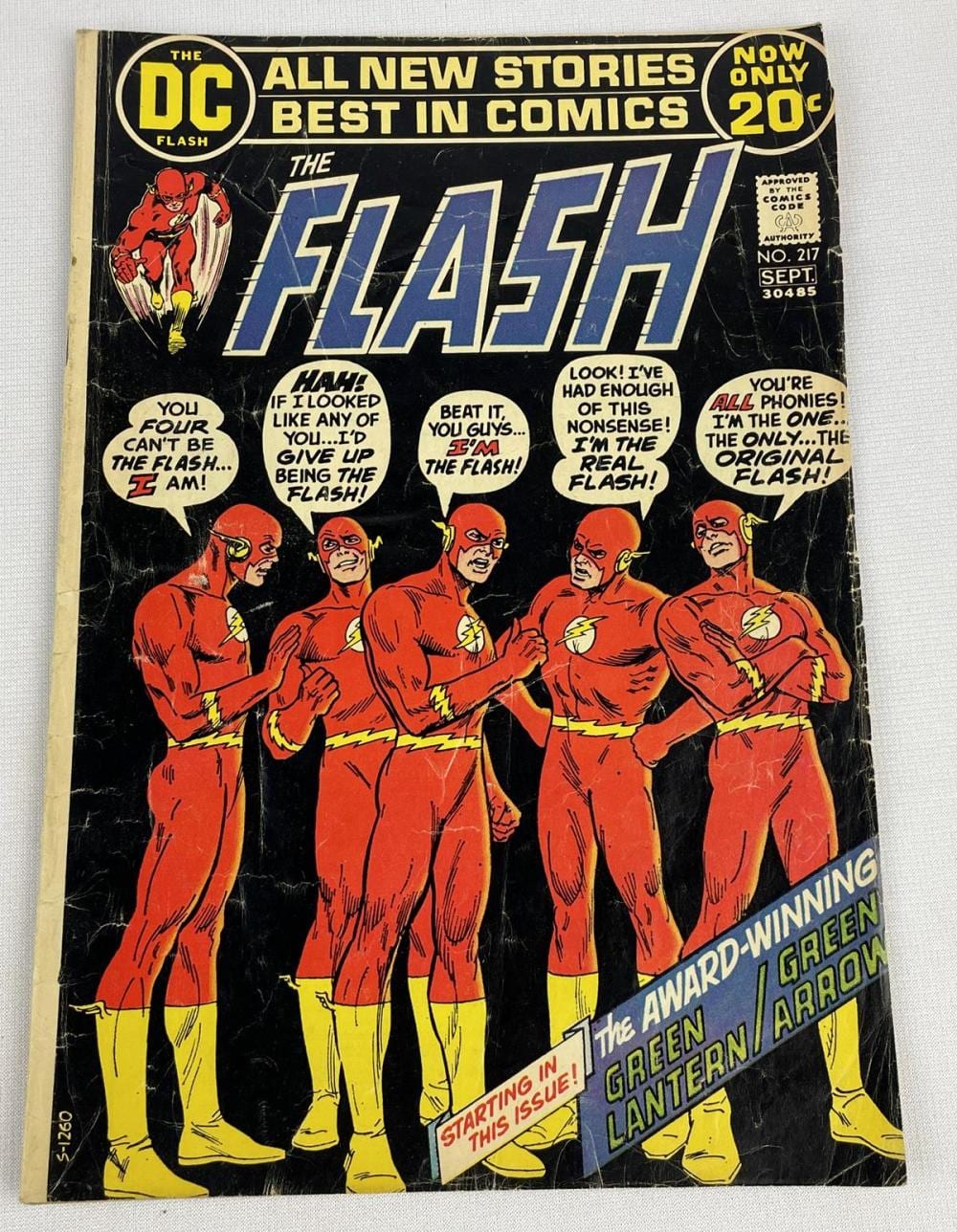 Cover of a vintage DC Comics The Flash comic book with red speedster characters and bold blue “FLASH” title.