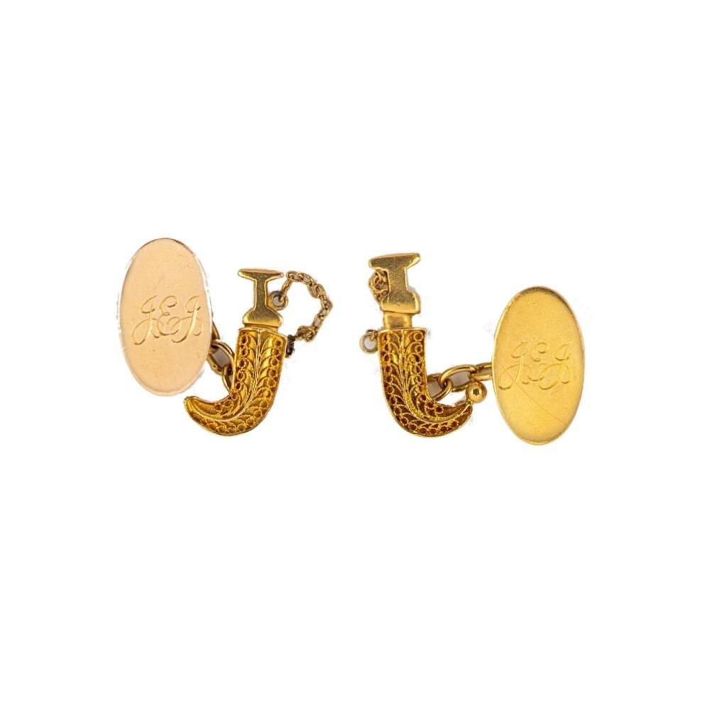 A pair of cufflinks, sold by Cheffins, lot 96 — auction record photograph