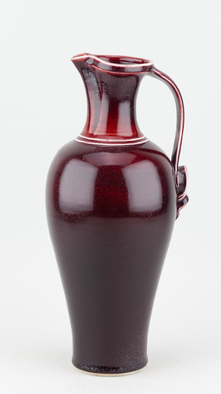 Bridget Drakeford comparable auction result: bridget drakeford born 1946 a tall porcelain jug covered in copper red glaze incised signature and japanese character mark height 34cm