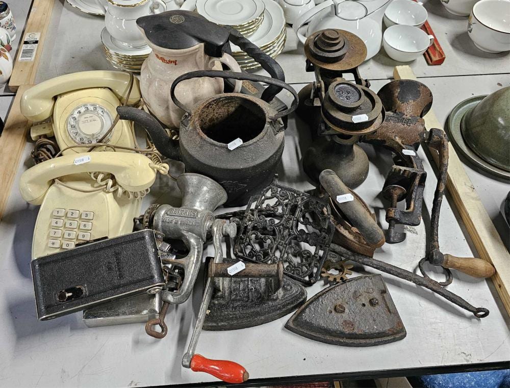 A collection of mostly cast iron wares, Inc. scales, meat grinder, iron, vintage telephones etc sold by Lawsons, lot 2607 — auction record photograph