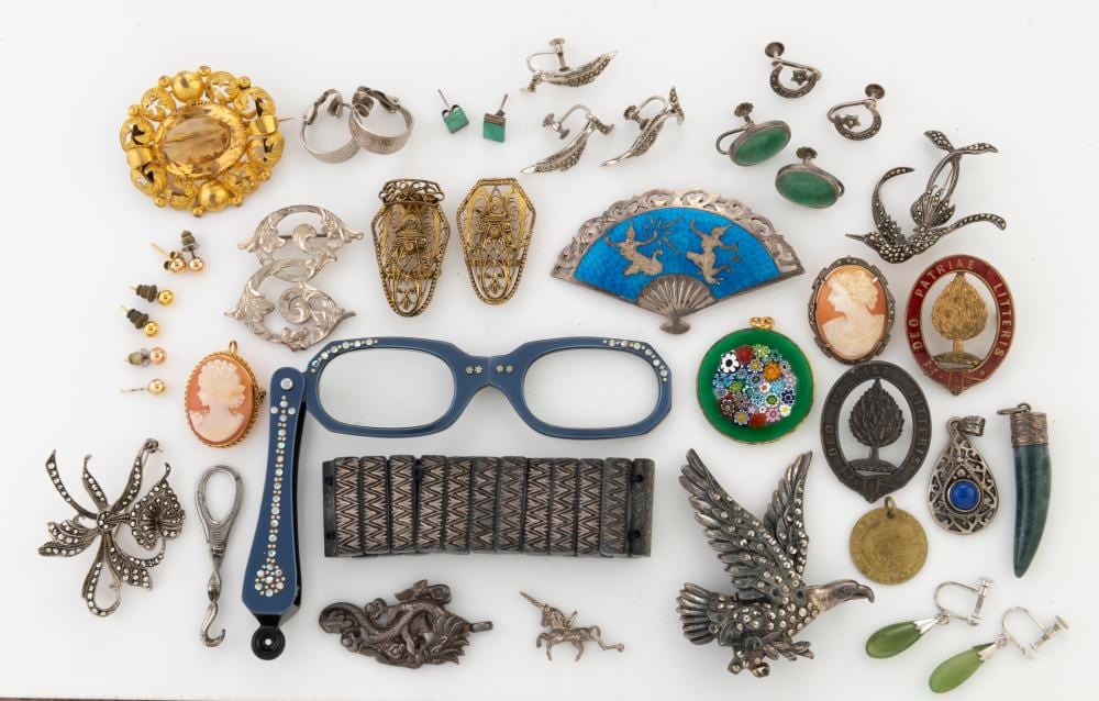 Vintage jewellery including silver and marcasite, cameo brooches, Siamese silver and blue enamel fan brooch, antique gaming token, lorgnettes, greenstone earrings, Murano glass pendant, bracelet, etc, (qty) sold by Leski Auctions Pty Ltd, lot 202 — auction record photograph