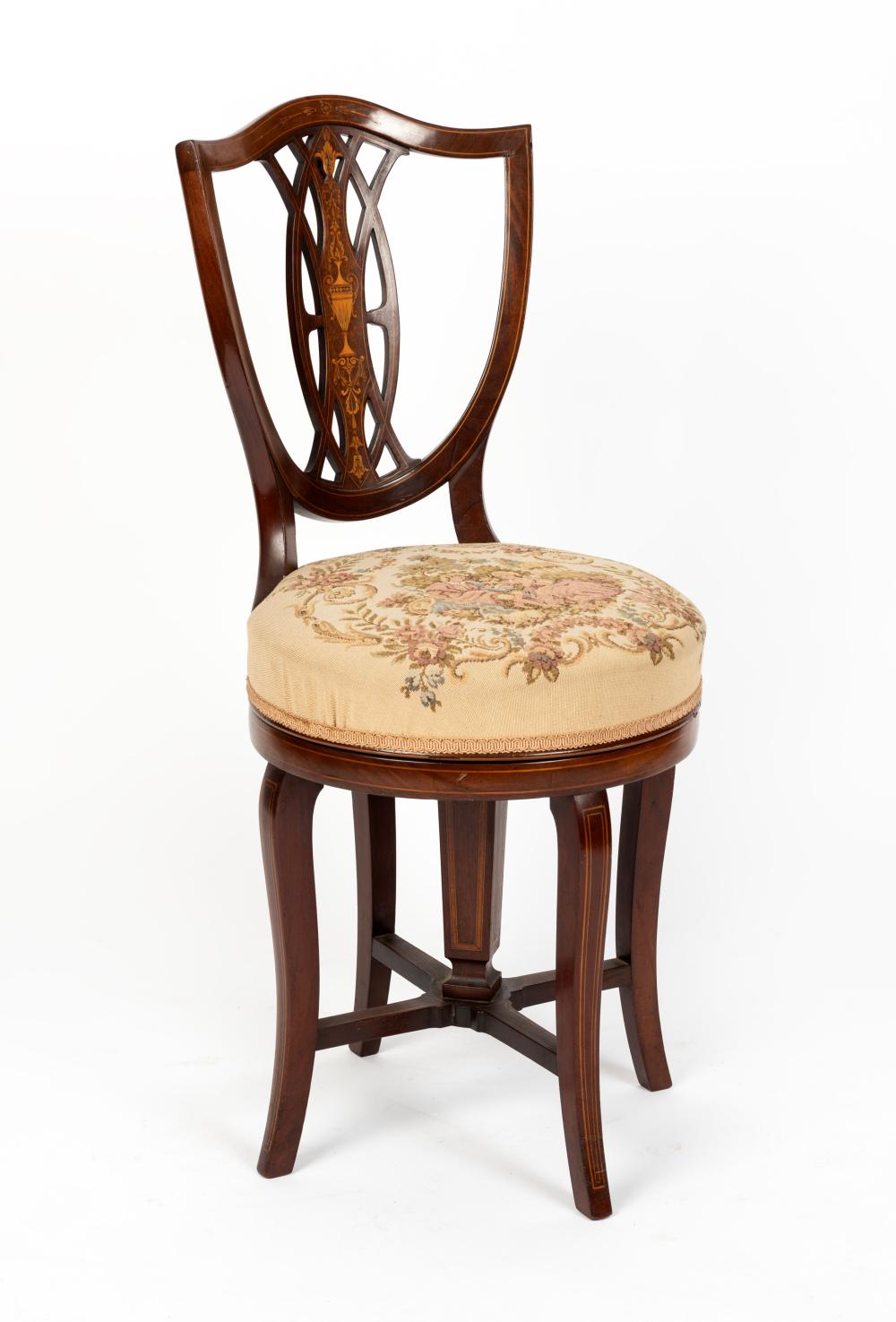An antique English Sheraton Revival mahogany revolving harpist chair with tapestry upholstered seat, late 19th century, 94cm high sold by Leski Auctions Pty Ltd, lot 604 — auction record photograph