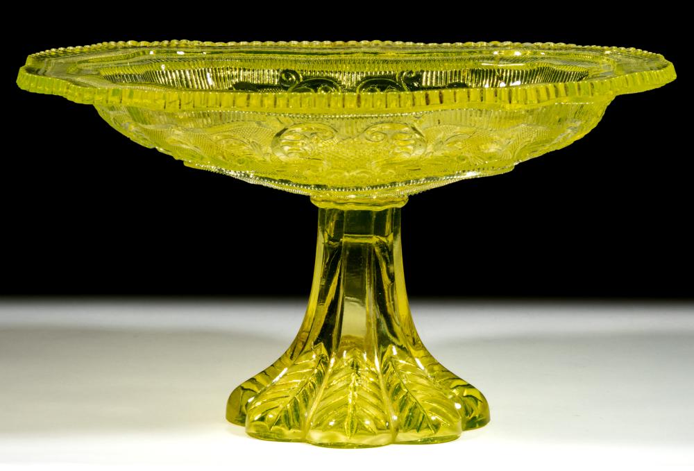PRESSED LACY PRINCESS FEATHER MEDALLION AND BASKET OF FLOWERS COMPOTE / DISH ON FOOT sold by Jeffrey S. Evans & Associates, lot 396 — auction record photograph