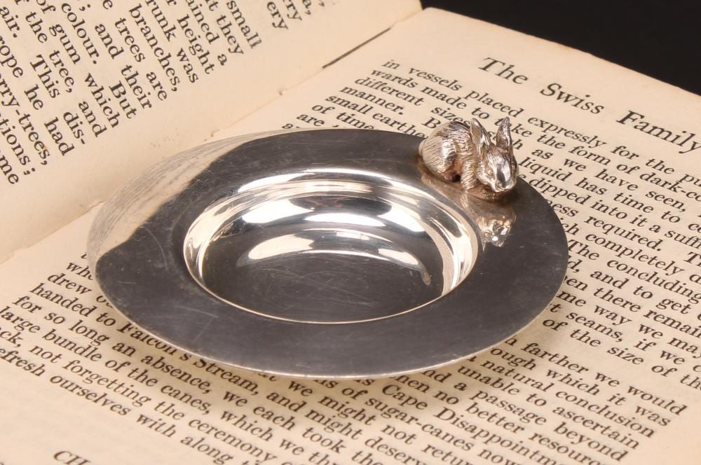 Sarah Jones comparable auction result: sarah jones an elizabeth ii silver circular novelty dish applied with a