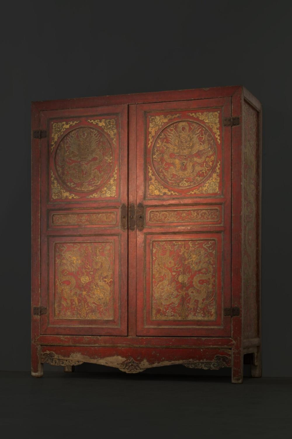 A massive and important imperial cinnabar lacquer slip-trailed and gilt-painted ‘dragon’ cabinet, Ming dynasty comparable sale