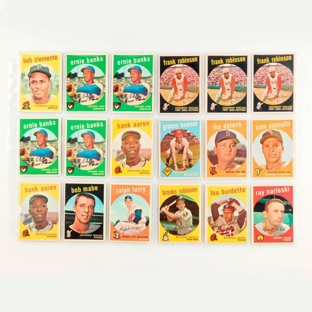 A group of vintage baseball trading cards featuring player headshots, including Ernie Banks, Frank Robinson, Hank Aaron, and others.
