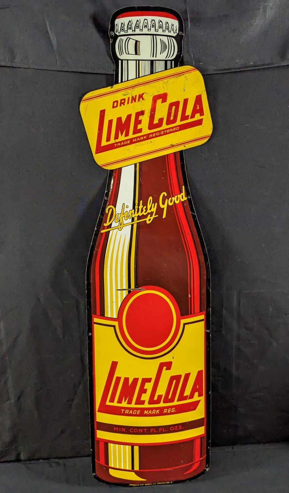 EMBOSSED TIN SIGN DRINK LIME COLA BOTTLE SIGN sold by Millers Auction Co., lot 177 — auction record photograph