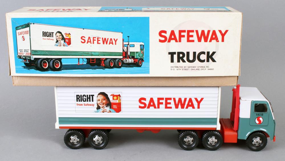Toy semi-truck with a Safeway logo trailer shown with its original shipping box behind it.