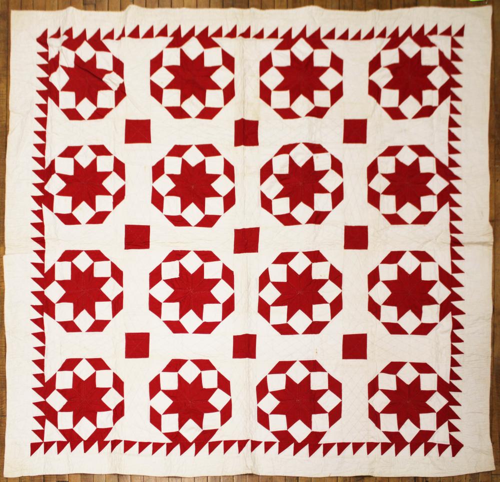 Vintage red & white ‘Star’ pieced bed quilt: saw tooth trim, oak leaf hand quilted border, cotton; 74’ X 75”; little dirty, some/few marks/staining sold by Roan Inc. Auctioneers & Appraisers, lot 635 — auction record photograph