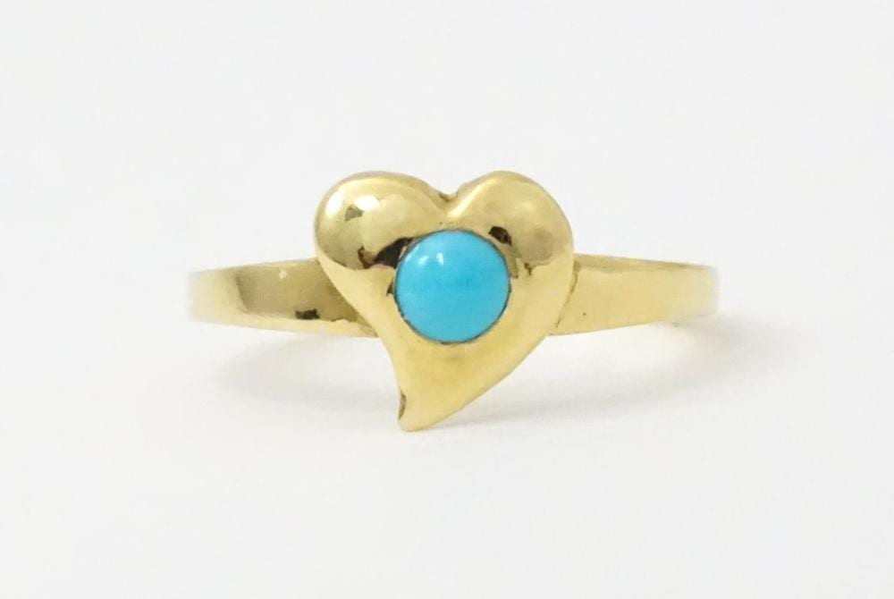Károly Kotász comparable auction result: a 10k gold ring with witches heart detail set with turquoise cabochon by k