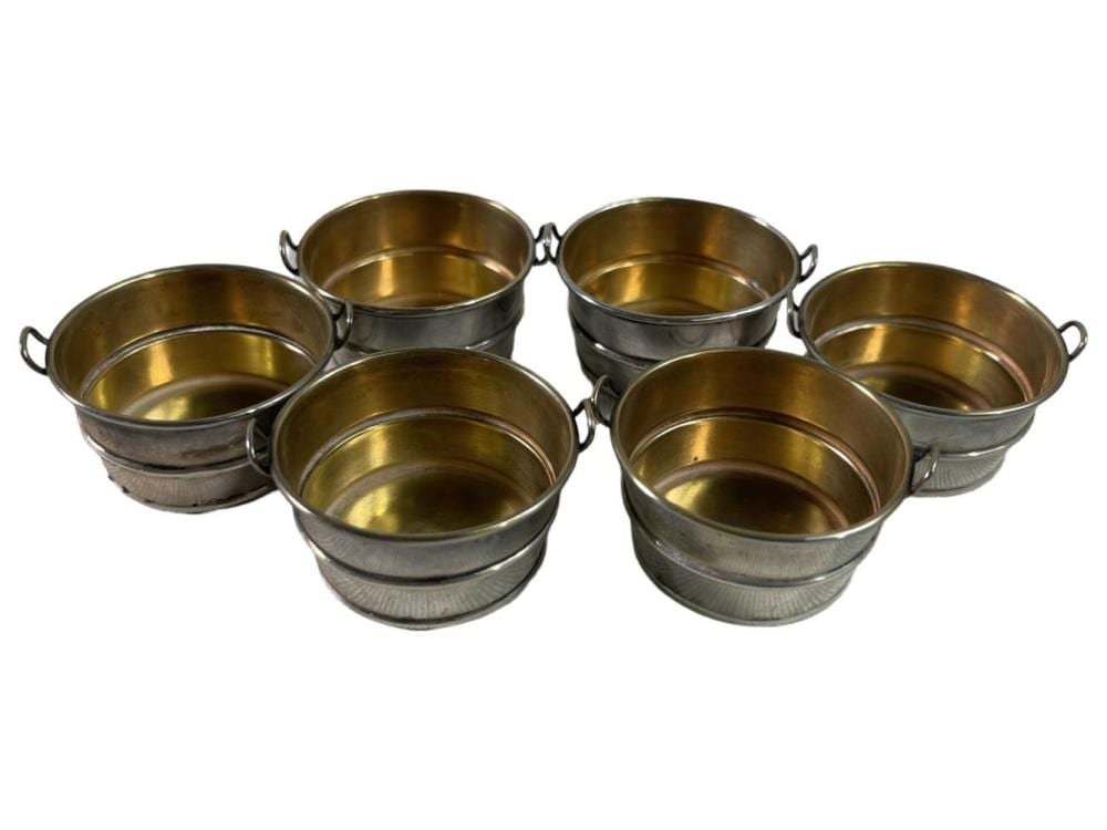 Six small metal salt cellars with side handles and gold-colored interiors, photographed on a white background.