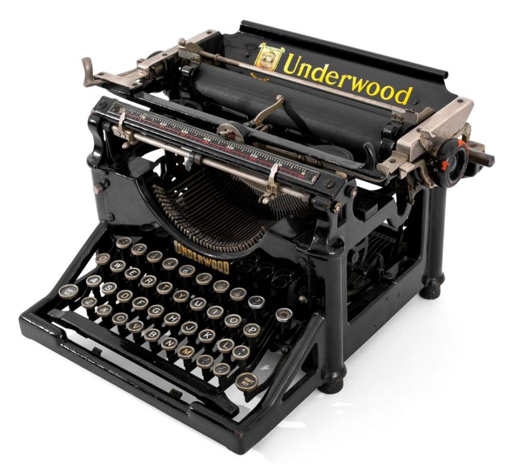 Black Underwood typewriter with visible keys, typebar mechanism, and the “Underwood” logo on the carriage.