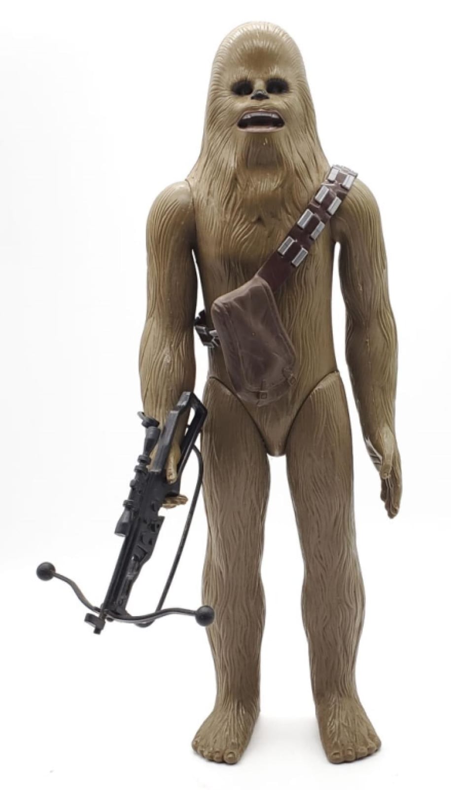 Photo of a Star Wars style Chewbacca action figure standing on a white background, with bowcaster blaster in front.