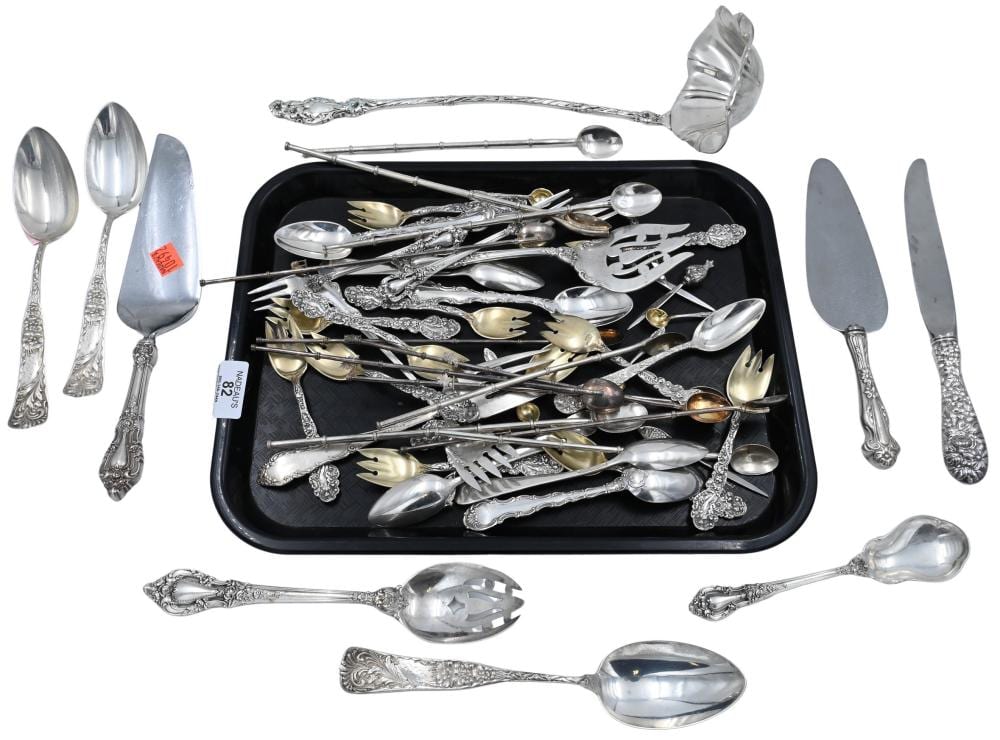 Group of Sterling Silver Flatware to include large ladle, spoons, forks, iced tea spoons, etcetera 46.8 t.oz. plus three weighted handles sold by Nadeau's Auction Gallery, lot 82 — auction record photograph