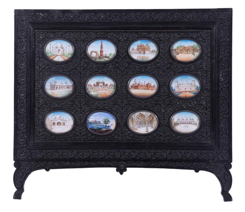 INDIAN EBONY PLAQUE WITH OVAL PAINTINGS sold by Thomaston Place Auction Galleries, lot 2522 — auction record photograph