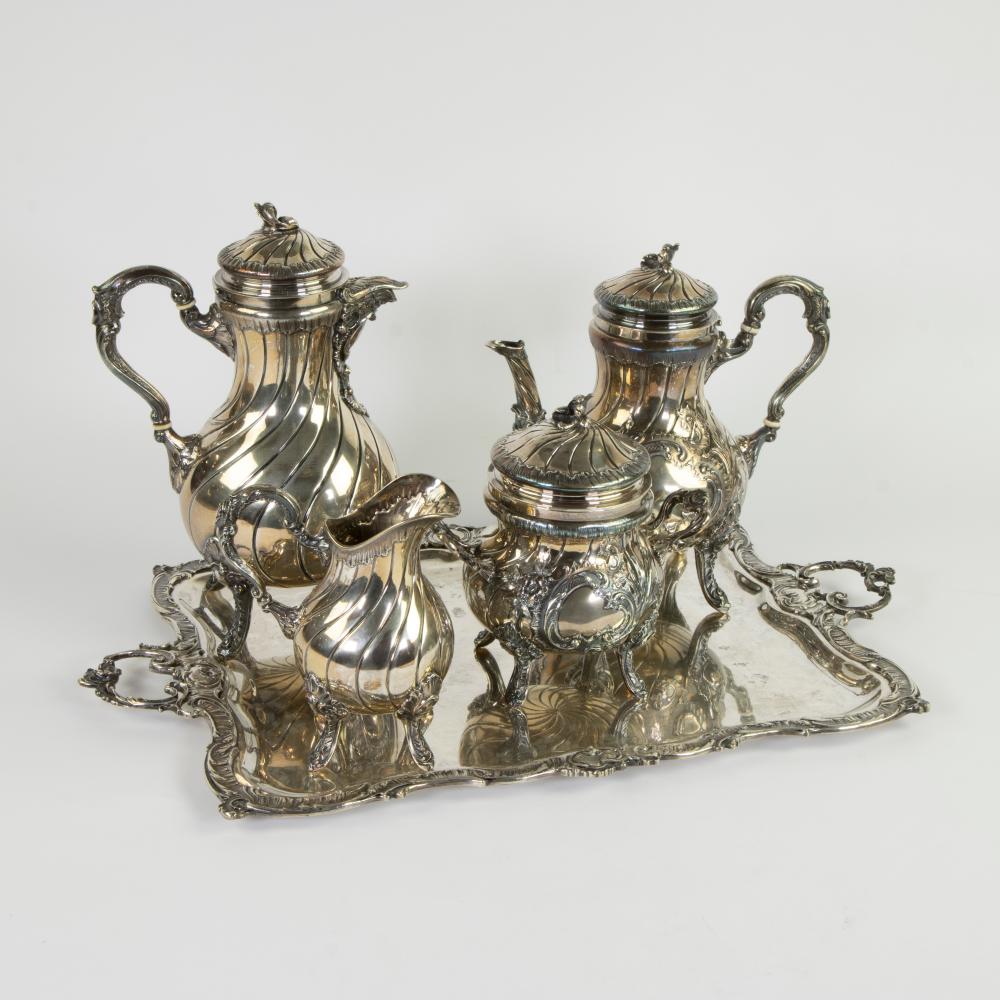Silver coffee and tea set DELHEID consisting of coffee, tea, sugar and milk pot with turned lid and belly, on four feet, the whole on a silver tray, driven Louis XV decor of rocailles and foliage, 1869/1942 Delheid frère sold by Maison Jules Veilinghuis, lot 786 — auction record photograph