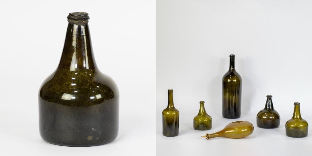 7 old glass bottles a.o. onion bottles and a bottle with a tin ring sold by Maison Jules Veilinghuis, lot 937 — auction record photograph