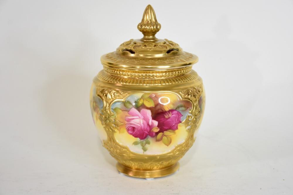 Milly Hunt. A good quality English Royal Worcester lidded vase having hand painted rose decoration, fine gilt highlights and pierced lid. H 19cm, W 12cm sold by Christian McCann Auctions, lot 12 — auction record photograph