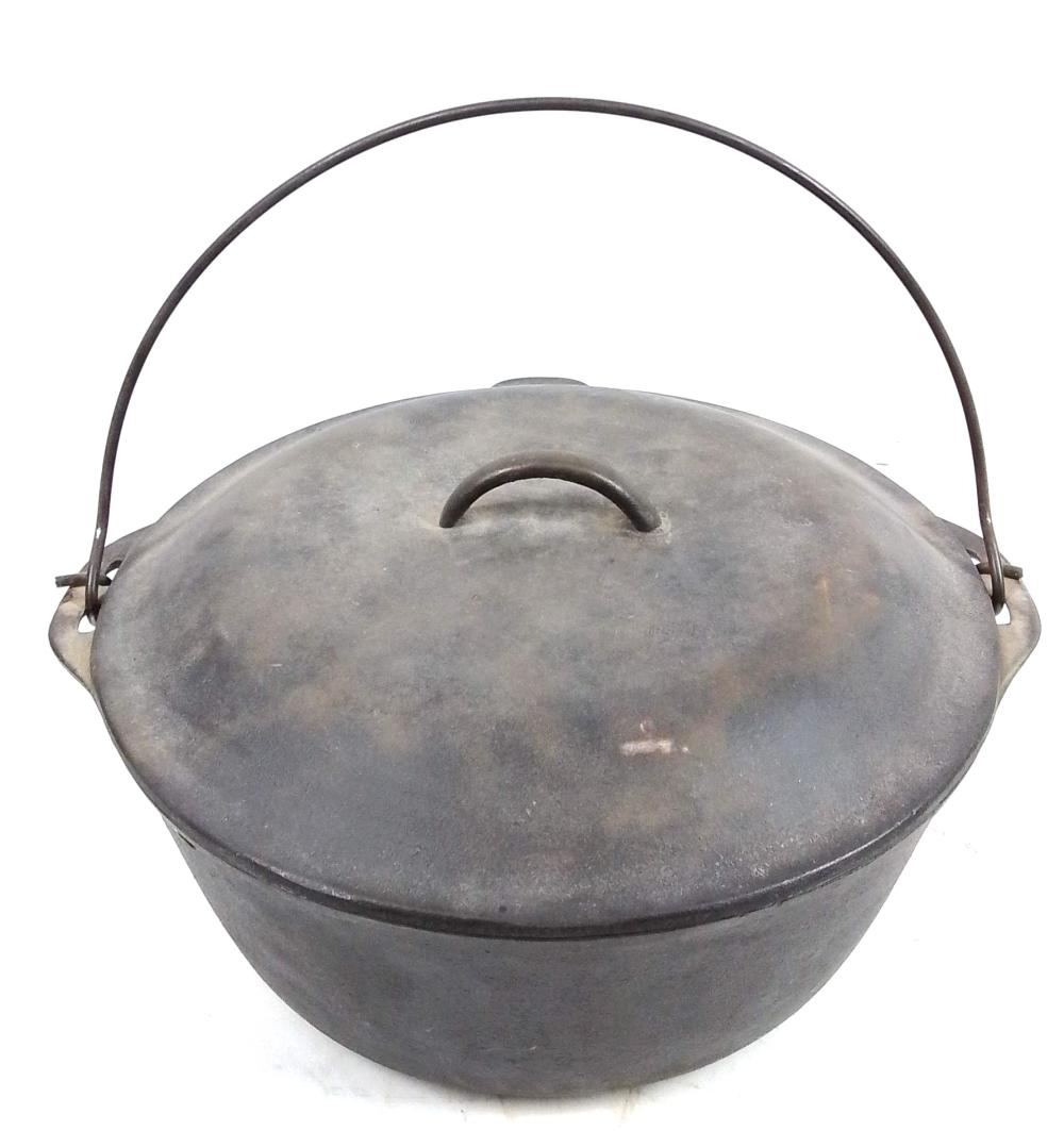 Gray cast iron Dutch oven with lid and loop handle, shown from the front against a white background.