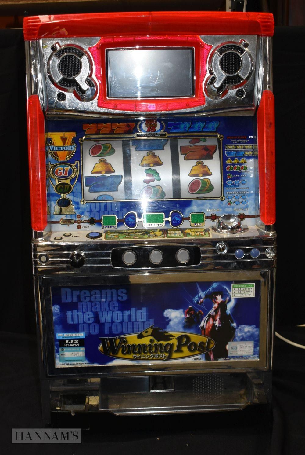 Red and chrome Japanese electric arcade slot machine with a central screen, speakers, and a payment/bonus panel reading “Victory” and “GI.”