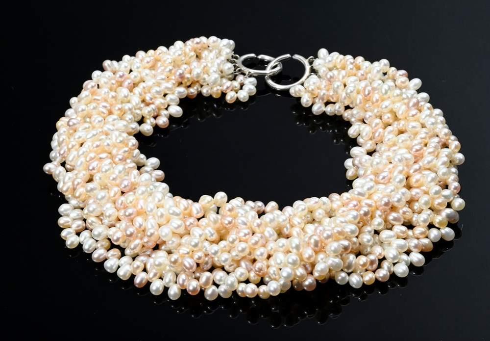 Auction comp thumbnail for Tiffany & Co pearl necklace ‘Paloma Picasso’ made of 10 apricot-coloured freshwater pearl strands on silver 925 ring clasp, signed, with case and box, 212g, l. 44,5cm, Ø 6,6x4,5mm (Kendzia, Lot 309)